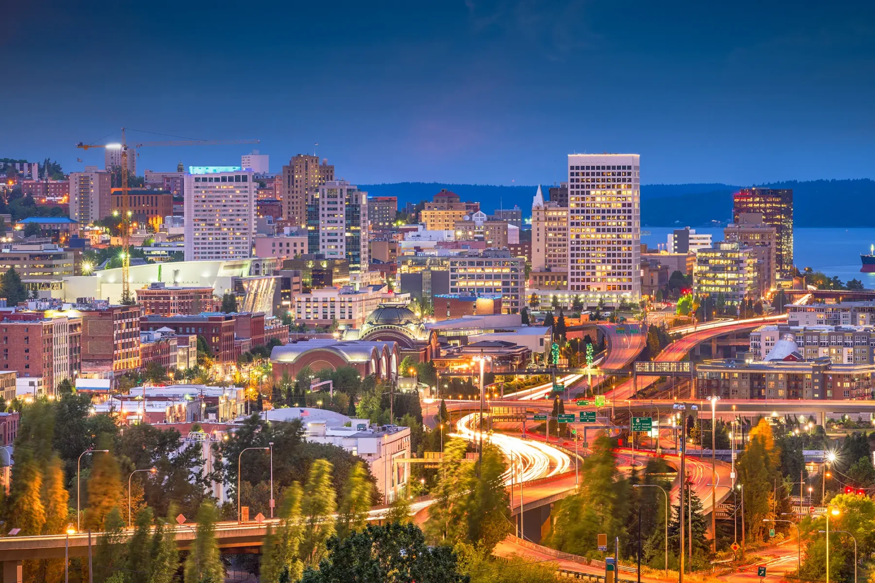 Tacoma Washington Skyline at dusk, lots of tall buildings and twisting highways