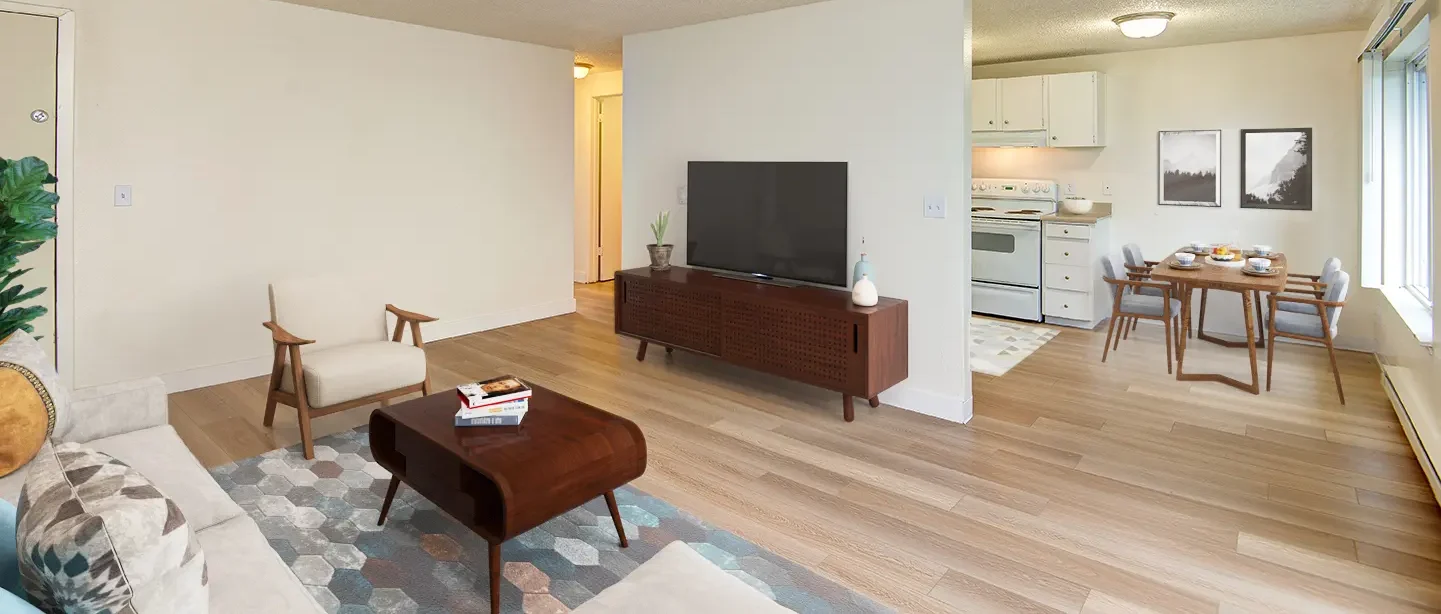 Open living space with view into kitchen and dining area