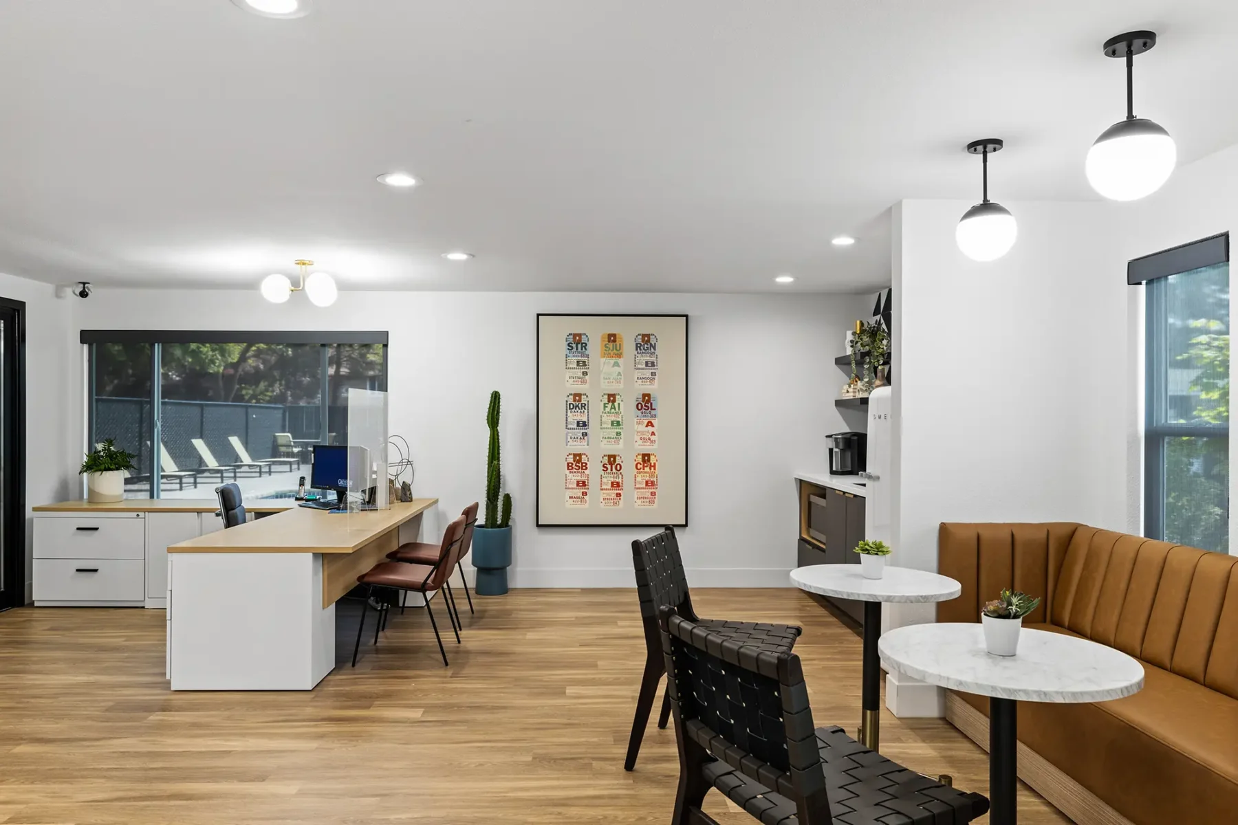 Leasing office reception desk and lounge area with kitchenette